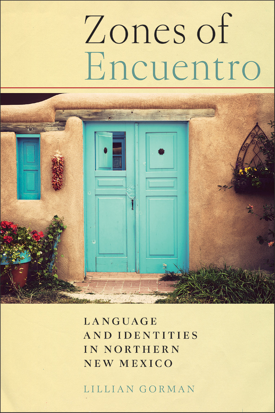 Front cover of Zones of Encuentro: Language and Identities in Northern New Mexico by Lillian Gorman, featuring a teal-colored New Mexican-style door set into an adobe brick wall. 